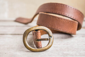 Brown leather belt with metal buckle